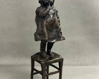 Another view of the vintage Juan Clara bronze sculpture, 13" tall, titled "Suzette on a Stool," depicting a young girl standing on a stool while holding her shoe; features a dark brown patina and has inscribed signature, foundry initials “LB” and edition number 347 as it was made using lost wax casting method. Very collectible item from Spanish artist Juan Clara (1875-1958).