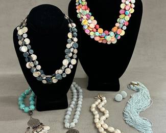 Beautiful beaded necklaces of all kinds – natural shells in polished discs; natural stone round bead pendant necklaces; multi-strand light blue beaded bib-style necklace with matching earrings, and baroque freshwater pearl necklace with sterling silver toggle clasp