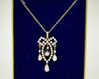 Closer look at the delicate and charming 14K gold, diamond, and pearl lavalier pendant on 10K gold chain necklace