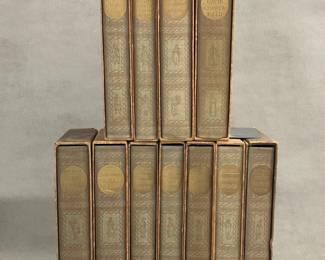 A set of 11 vintage illustrated Charles Dickens novels published by The Heritage Press, New York. Cloth hardcovers with distinctive gold lettering on the spines, each book in a protective slip case. Copyright 1939 The Heritage Club. Books comprise The Adventures of Oliver Twist, The Mystery of Edwin Drood (two copies), The Old Curiosity Shop, David Copperfield, The Pickwick Papers, Nicholas Nickleby, The Christmas Novels, A Tale of Two Cities, Barnaby Rudge, and Great Expectations.
