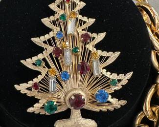 Closeup of the Brooks gold tone multi-rhinestone Christmas tree brooch