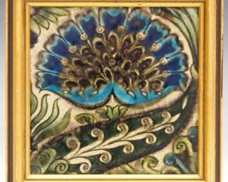 A late 19th century William De Morgan Art Pottery tile. "Mongolian" pattern tile in shades of Blue and Green, against a creamy White ground. Impressed "D.M. 98" within a circle verso. Crazing, some flakes around edges, small loss at one corner. Tile 6 x 6" high, framed 7 1/2 x 7 1/2" high overall. ESTIMATE $400-600