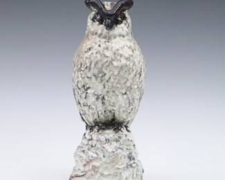 An early 20th century Michael Andersen & Son Art Pottery figure. Molded Owl figure with multi-color crackle glaze. Applied lozenge with Danish Three Fish in a Shield with incised marks. Minor wear. 9" high. ESTIMATE $100-200