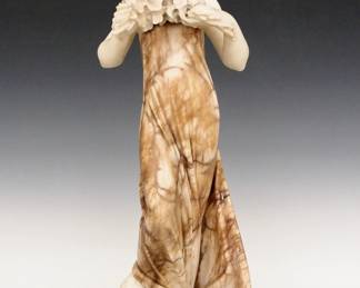 An Italian Art Nouveau Alabaster and Marble sculpture. Carved figure of a woman shown holding a floral garland. Unsigned. 13 5/8" high. Wear overall with some fill evident. ESTIMATE $400-600