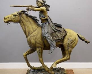 Jim Davidson, American, b. 1962. A late 20th century Bronze garden sculpture of a Native American warrior on a war pony. Depicts the rider aiming his rifle while the pony is at a full gallop. Signed in the casting "Jim Davidson". Two-tone patina with weathered surface. 84 x 28 x 77" high overall. ESTIMATE $2,000-3,000