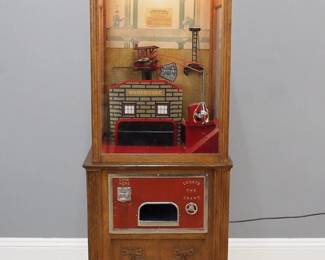 An early 20th century Iron Claw coin-op arcade machine. 5 cent machine with a clam shell claw which drops to retrieve a prize. In a Oak cabinet with reverse painted marquee top, applied carvings and Nickeled claw feet, with upper and lower access doors. Restored working condition, repairs and replacements. 24 x 18 1/2 x 79" high overall. ESTIMATE $800-1200