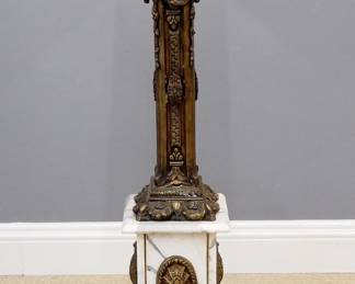 A late 20th century Neoclassical display pedestal. Bronze and marble construction with a cast foliate column. Some wear, repaired crack in top of base. 12 x 12 x 47 3/4" high overall. ESTIMATE $400-600