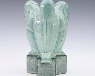 An early 20th century French Art Deco Period Art Pottery figure attributed to Claude Levy. Molded body with sculptural three Owl design and mottled Green/Blue glaze. Painted "Levy" signature and printed "France" mark. Minor wear. 8 3/4" high. ESTIMATE $200-400