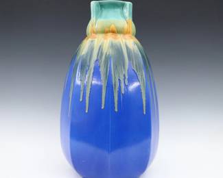 A turn of the century Belgian Art Pottery vase. Molded body with buttressed neck and multi-color drip glaze on a Cobalt Blue ground. Molded "Belgium" mark. Minor wear. 18 1/2" high. ESTIMATE $300-400