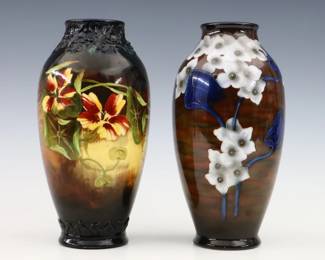 Two turn of the century Royal Bonn Art Pottery vases. Baluster form with multi-color floral decoration. Printed "Royal Bonn / Germany" with impressed and painted marks. Vase with Yellow flowers has professionally painted touch-ups at rim and foot, other with minor wear. Up to 9" high. ESTIMATE $100-200