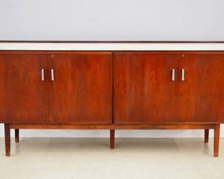 A Mid Century Modern entertainment cabinet. Teak construction with a Travertine top, features four hinged doors opening to reveal adjustable shelves and a pull out turntable shelf on a five legged lift off base. Original finish with some wear. 84 x 18 x 38" high overall. ESTIMATE $800-1,200