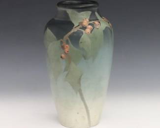 An early 20th century Rookwood Vellum Art Pottery vase decorated by Sara Sax. Baluster form with polychrome leaf and berry decoration on a tonal Green ground. Impressed Rookwood mark, Roman numerals "V" (1905) shape "943D", "V" (Vellum glaze) and "SX" artist monogram. Crazing, some discoloration. 8" high. ESTIMATE $400-600
