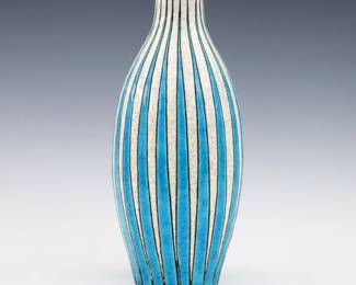 An early 20th century Art Deco Period Boch Freres Keramis Art Pottery vase by Maurice Dufrene. Baluster form with incised linear decoration and multi-color crackle glaze. Painted "M. Dufrene" signature and "La Maitrise / fabrique a Keramis La Louviere (Belgique)" with impressed marks. Minor wear, slight roughness at rim. 10 3/4" high. ESTIMATE $300-400