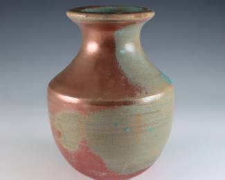 An early 20th century Pewabic Pottery vase. Baluster form with iridescent glaze in shades of Copper, Green and Gold. Impressed circular "Pewabic Detroit" mark. Crazing, slight surface wear. 6" high. ESTIMATE $800-1,200
