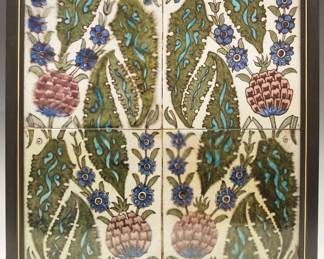 A set of four late 19th century William De Morgan Art Pottery tiles. Aesthetic Period tiles, in floral and leaf motifs, are each in colors of Mauve, Blue, Turquoise, and Green against a White ground. Crazing, some minor roughness and small flakes around edges. Each is 6 x 6", framed as one within a contemporary black frame, 13 1/2 x 13 1/2" high overall. ESTIMATE $1,000-1,500