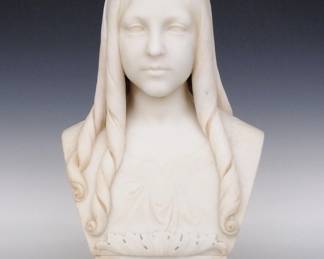 Nicola Cantalamessa-Papotti, Italian, 1831-1910. Carved marble bust of a young girl with ringlets on a carved plinth adorned with acanthus leaves at the top. Signed and dated "N. Cantalamessa Papotti, 1859" on the plinth. Some surface wear, minor edge flakes. 12 x 9 x 21" high overall. ESTIMATE $2,000-4,000
