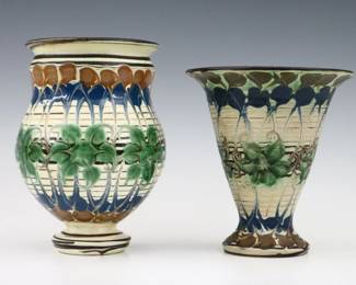 Two turn of the century Herman Kahler Art Pottery vases. Bulbous and flared forms with multi-color abstract decoration. Incised "HAK" monogram and impressed "Denmark" marks. Minor wear. Up to 7 1/4" high. ESTIMATE $200-400
