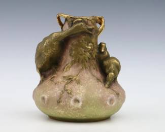 A late 19th century Amphora Art Pottery vase. Molded body with an applied Duck and ducklings at the neck, multi-color decoration and Gilded detail. Impressed "Amphora / Austria" with Crown marks, painted numerals. Minor wear and crazing. 6 1/4" high. ESTIMATE $200-400