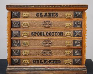 A turn of the century Clark's Spool Cabinet. Oak construction features six labeled dovetailed drawers with brass handles. Older refinish with some wear, some separation, nicks/losses. 25 1/2 x 17 3/4 x 22" high overall. ESTIMATE $400-600