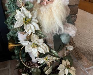 Large selection of Christmas decor, including numerous Santa figurines.