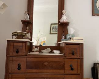 Antique Eastlake-style dresser with white marble top surfaces.