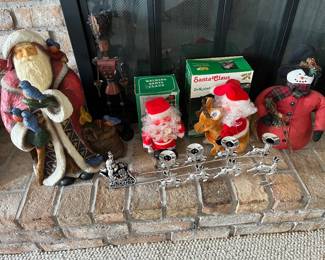 Large selection of Christmas decor, including numerous Santa figurines.