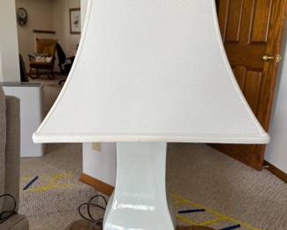 White ceramic table lamp with crackle glaze finish.