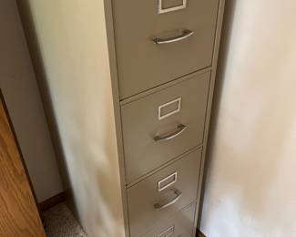 Four-drawer vertical filing cabinet.