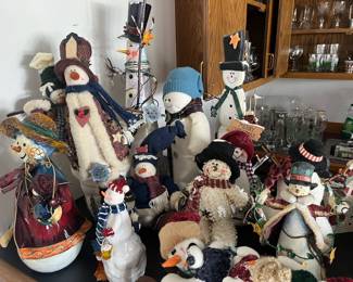 Lots of holiday/Christmas decor, including many snowman figurines.
