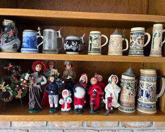 Collections of vintage German beer steins and Byers’s Choice Caroler figurines.