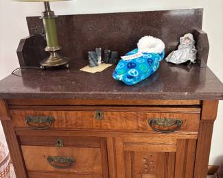 Antique Eastlake-style washstand with marble top.