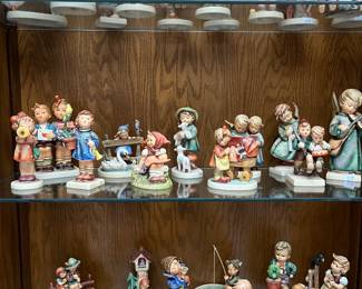 Large collection of Hummel figurines.