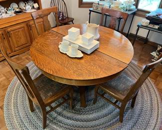 Vintage oak dining top with round top and prominent grain pattern.