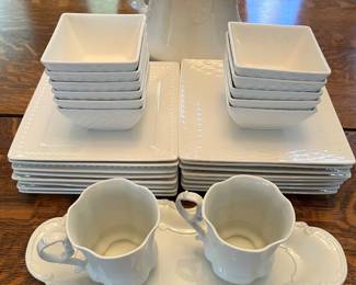 Vintage white embossed pitcher; porcelain cups with matching tray; vintage white square dinnerware set.