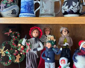 Collections of vintage German beer steins and Byers’s Choice Caroler figurines.
