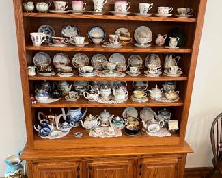 Traditional oak hutch featuring open shelving and a closed cabinet base.