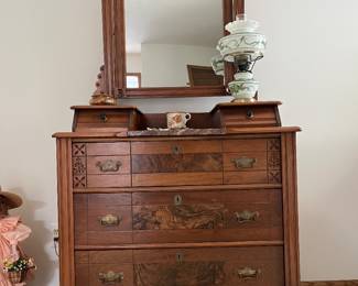 Victorian-era walnut dresser featuring a marble insert and a swivel mirror.