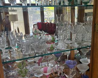 Large selection of Waterford crystal, other fine crystal and glassware, and a fun collection of martini glasses in various styles.