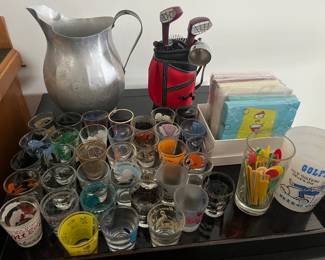 Lots of barware and drinkware, including this collection of shot glasses.