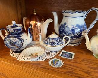 Lovely collection of teapots to be sold, a few of them shown in this photo.