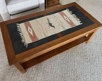 Wooden coffee table with slate top.
