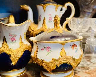 Magnificent Meissen coffee service in “Royal Blue Gold Bronze Strewn Flowers” pattern, Germany, 20th century.  Inspired by the German Baroque and Rococo periods.    The pieces are hand painted on porcelain with opulent 23 karat gold on the high relief of the ornaments and borders. 