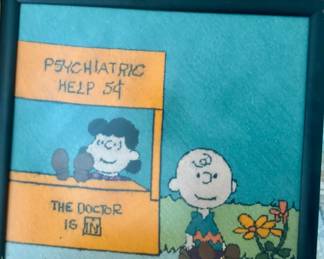 framed art piece features a classic "Peanuts" comic scene titled "Psychiatric Help 5¢