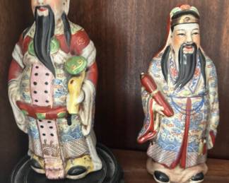 vintage porcelain figurine of a Chinese deity, possibly representing Lu Xing (the God of Prosperity) or a similar character from the Fu Lu Shou triad.Right - vintage porcelain figurine of a Chinese deity, possibly representing Fu Xing, the God of Fortune