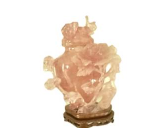 Vintage Chinese carved rose quartz covered urn or vase, often featuring detailed relief work 