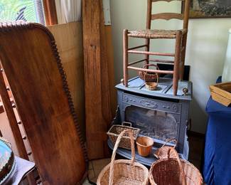 Vintage ladder back chair, woven baskets, and antique bobbin-turned bed frame