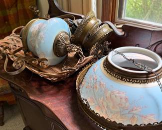 Antique, retractable, electrified, oil lamp. Brass ornate detailing.