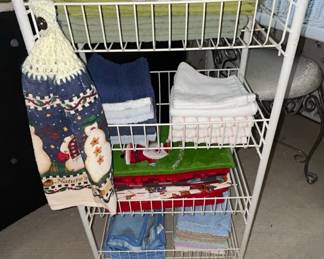White Tier Wire Rolling Utility Cart with Assorted Linens