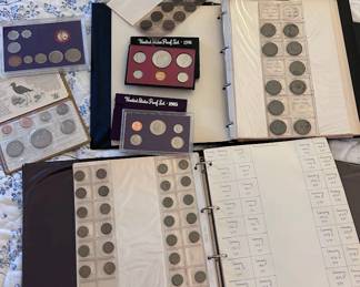 Several books of coins. Mostly from Australia and Germany