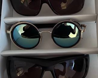 Sunglasses including a pair of Maui Jim Island Time sunglasses